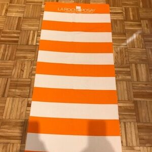 La Roche-Posay Orange and White Striped Towel
